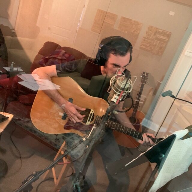Adam Klein in a recording booth.